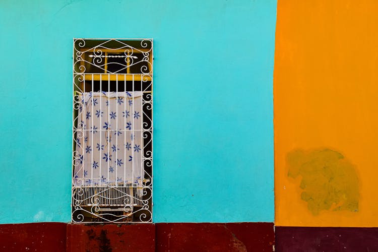 White Metal Bars On Window Of House In Havana, Cuba