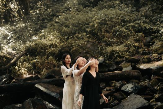 Women in Dresses Posing in Wilderness