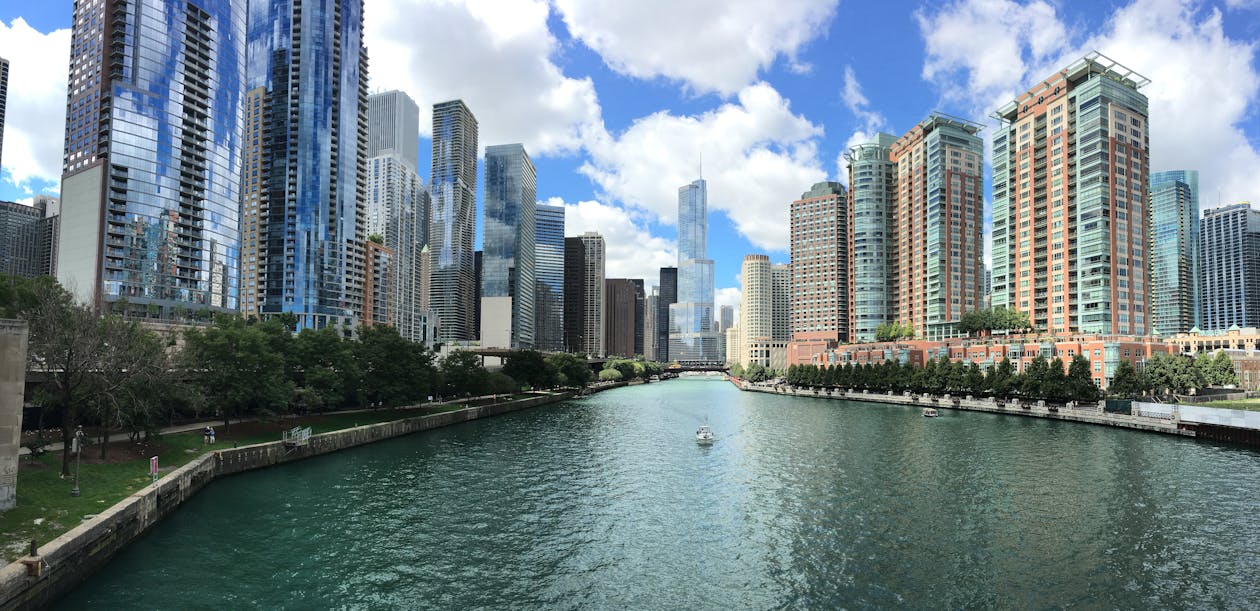 City With River in Middle during Cloudy Day