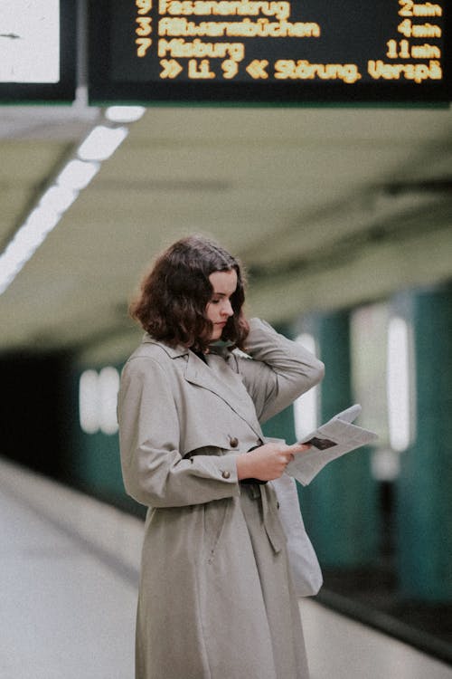 Woman in Trench Coat at Metro Station in Hannover