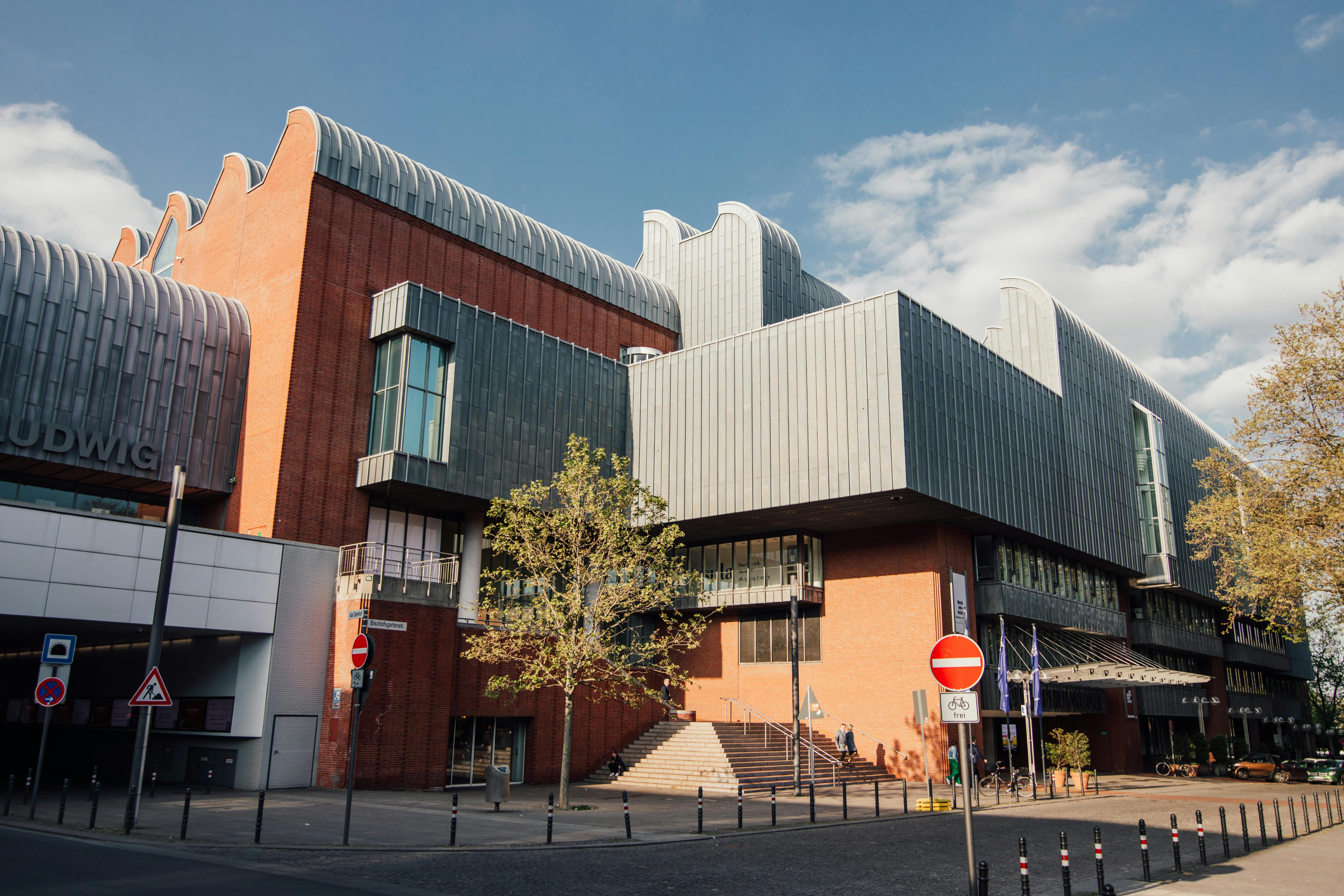 the building is made of metal and has a large metal roof