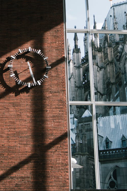 A clock is on the wall of a building