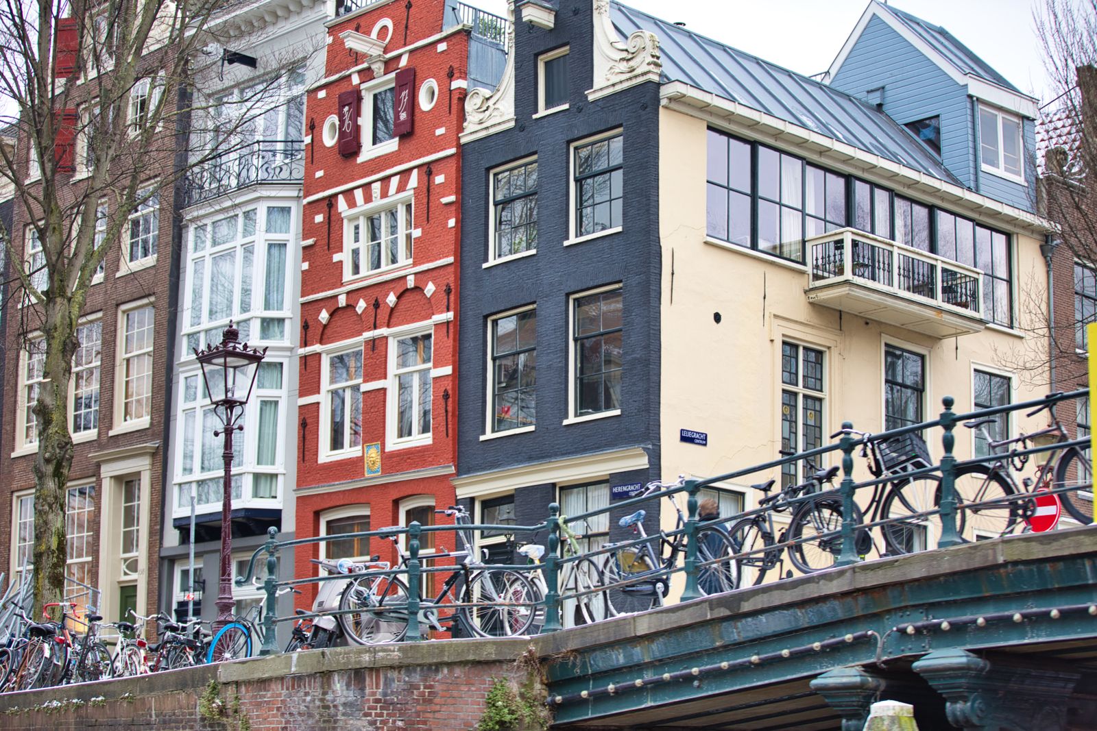 Bicycles parked along an Amsterdam canal street