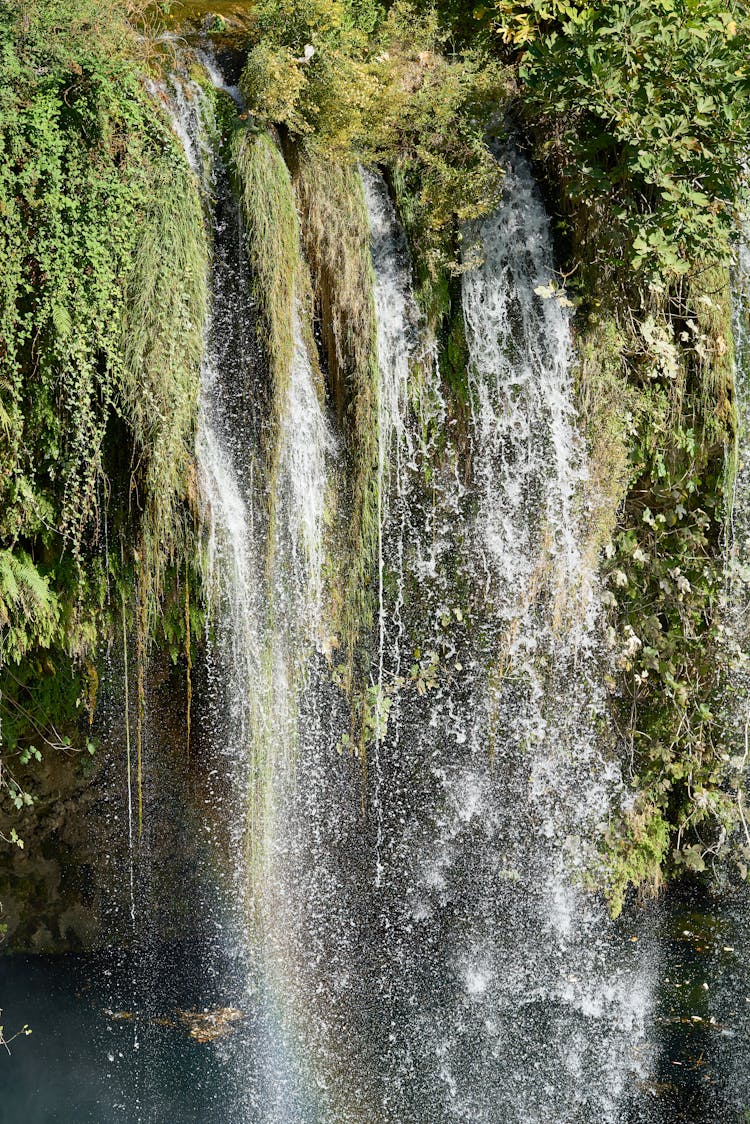 Time-lapse Photography Of Flowing Plunge Waterfalls