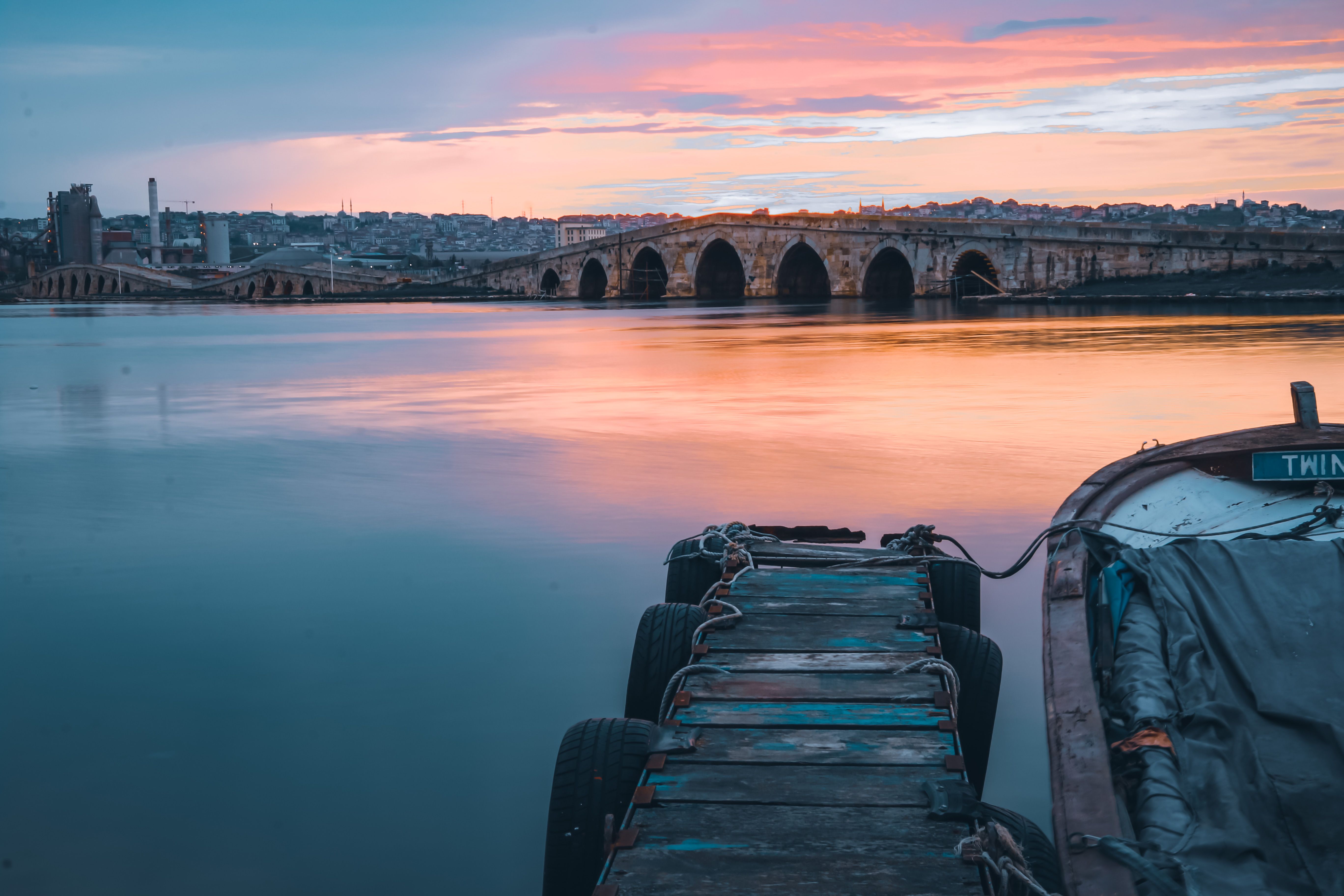 Pier in Water on Dramatic Sunset · Free Stock Photo
