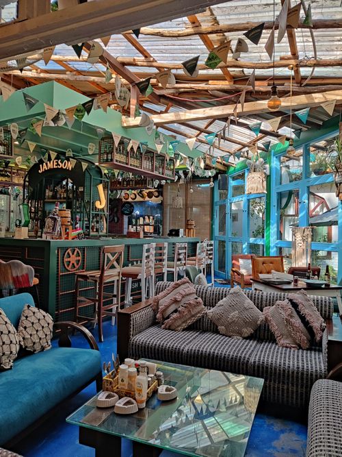 Free Charming rustic restaurant interior with wooden decor and cozy seating in Kasol, Himachal Pradesh. Stock Photo