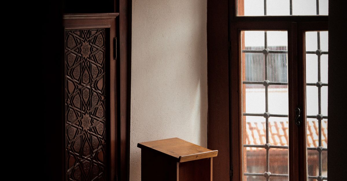 Empty Lectern Standing by a Window · Free Stock Photo