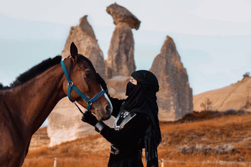 Woman with a Horse in a Desert 