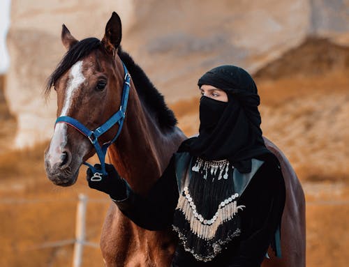 Photo of a Woman with a Horse 