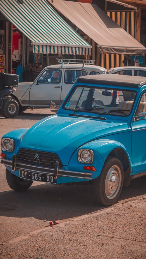 Free Retro Citroen Dyane 6 from 1972 parked on a bustling street, showcasing vintage charm. Stock Photo