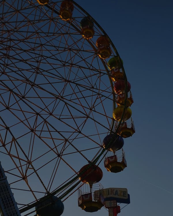 Low Angle Shot of a Ferris Wheel in the Evening