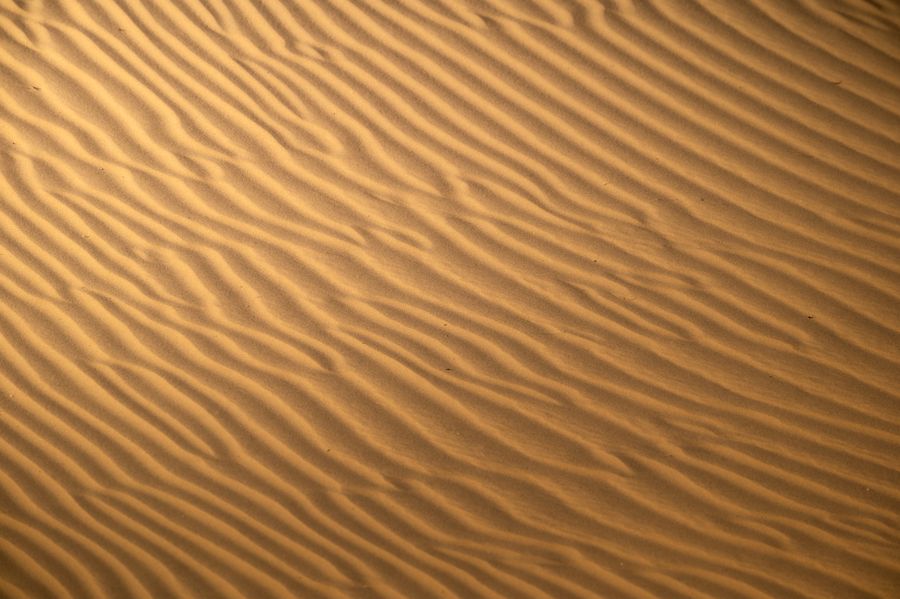Aerial view of golden sand dunes by Zetong Li on Pexels