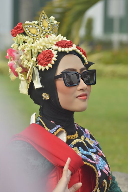 Woman in Sunglasses and Traditional Clothing