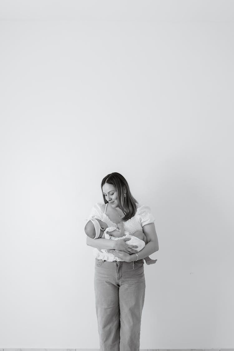 Mother Holding Baby In Black And White