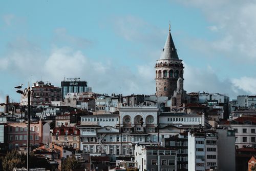 Free View of Galata Tower amidst Istanbul's historic skyline on a clear day. Stock Photo