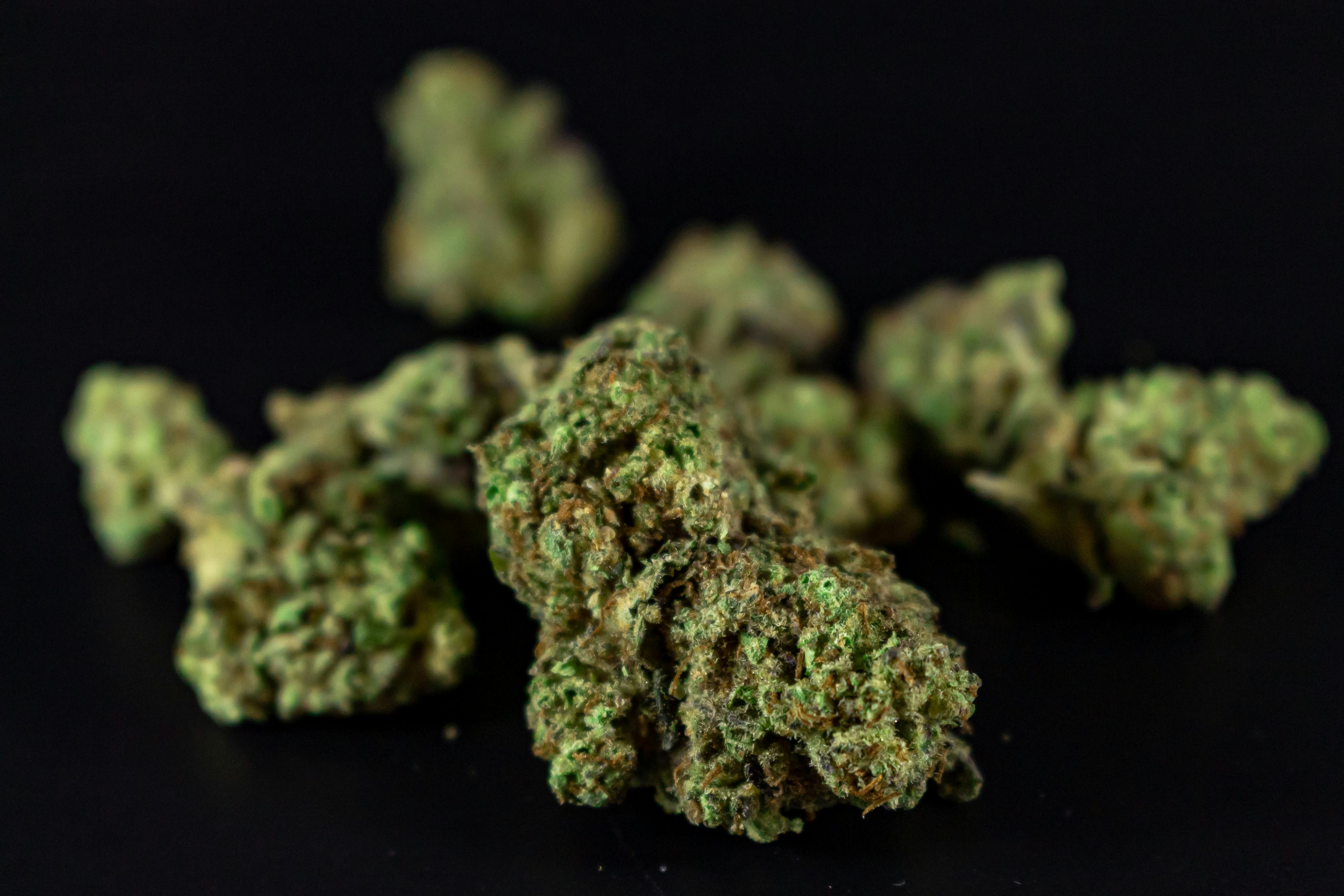 Free High-quality close-up image of cannabis buds against a dark background. Stock Photo