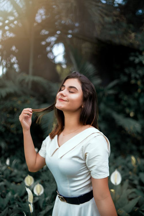 Smiling Brunette Woman in White Clothes