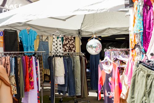 Free Vibrant outdoor clothing bazaar with various garments on display in Los Angeles, CA. Stock Photo