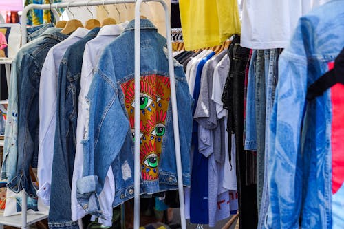 Free A rack of clothes with different colored jackets Stock Photo