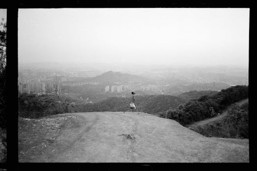 Black and white urban landscape of Seul, South Korea, overlooking hills and cityscape.
