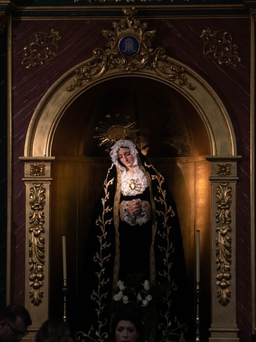Free Intricate religious sculpture housed in a beautifully ornate cathedral alcove. Stock Photo
