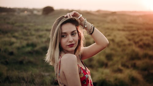Blonde Woman Posing on Meadow