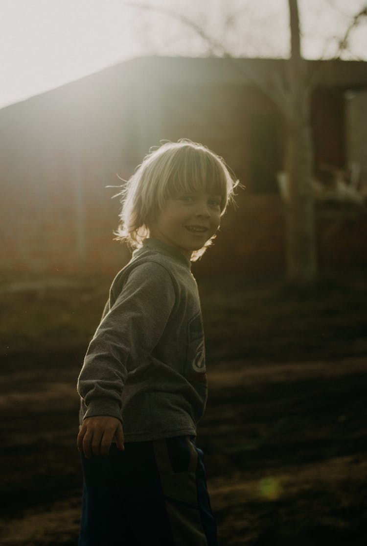 Running Boy Looking Over His Shoulder