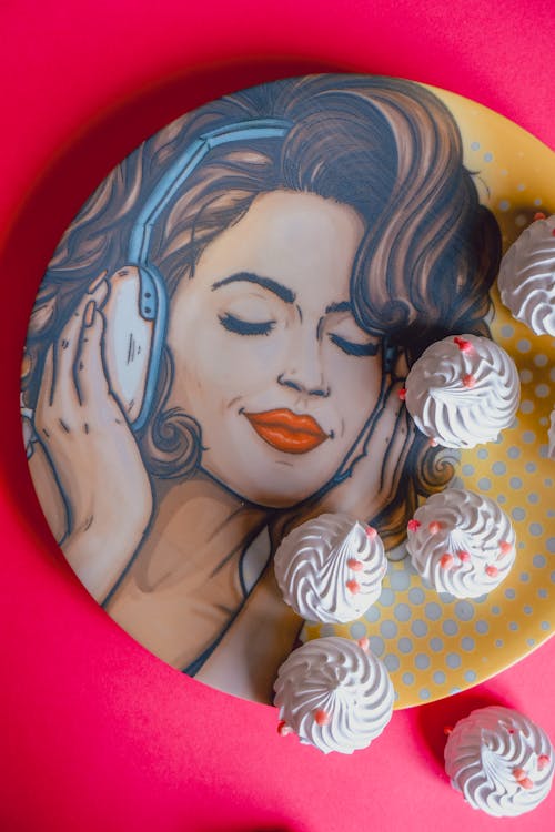 Meringues on a Plate with a Drawing of a Woman