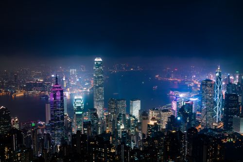 Free Captivating aerial view of Hong Kong's illuminated skyline with iconic skyscrapers at night. Stock Photo