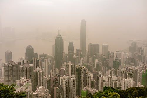 Aerial View of Skyscrapers in Downtown Hong Kong Covered in Smog