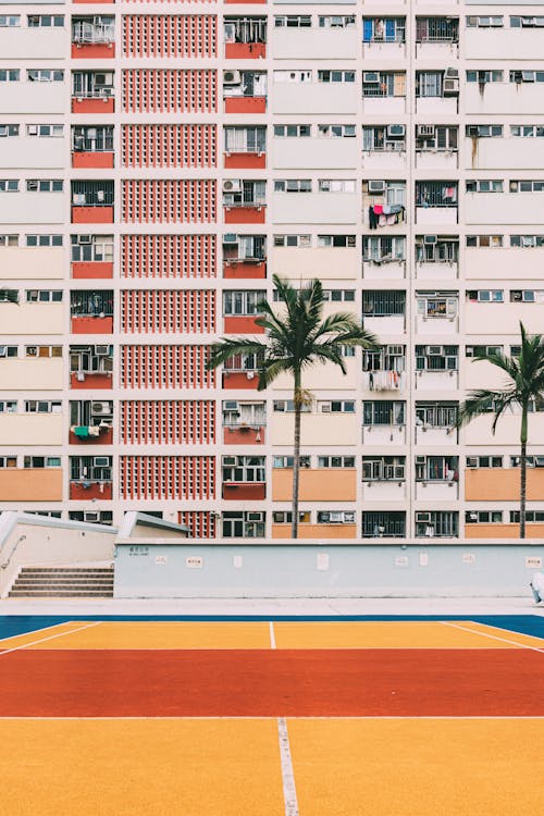 Basketball Court between Residential Buildings in City 