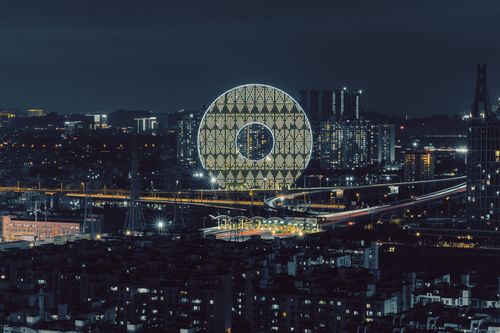 Free Night view of the illuminated Guangzhou Circle, a modern architectural landmark in China. Stock Photo