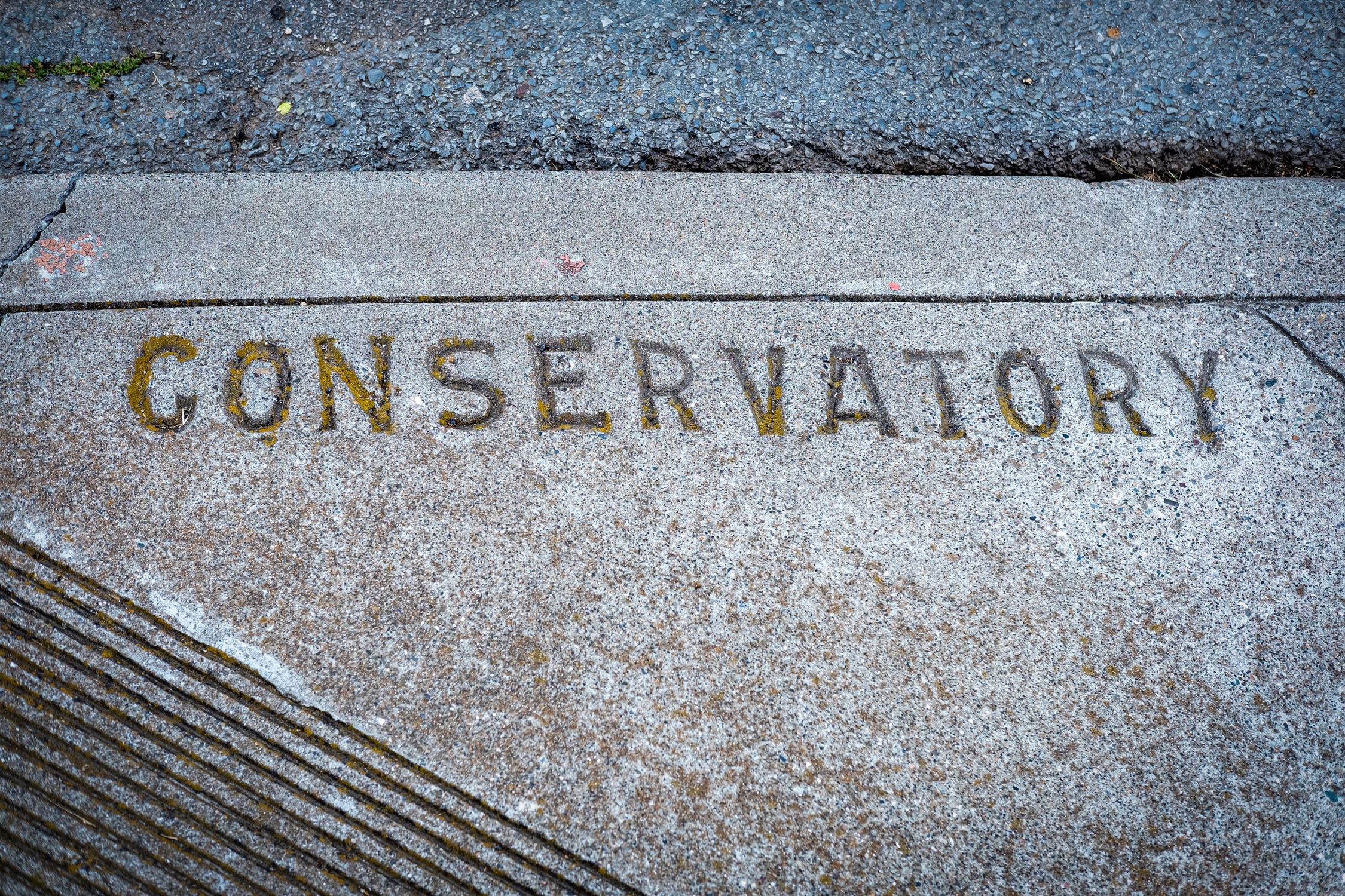 Writing Carved into a Sidewalk Slab · Free Stock Photo