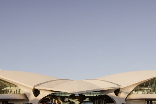 Stunning architectural design of the TWA Flight Center in New York's JFK Airport captured in daylight.