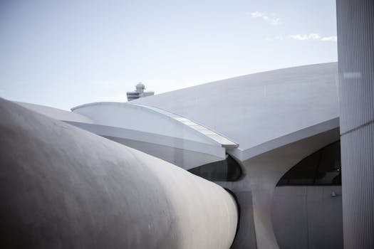 Abstract view of futuristic architecture at JFK Airport, New York, showcasing sleek curves and modern design.