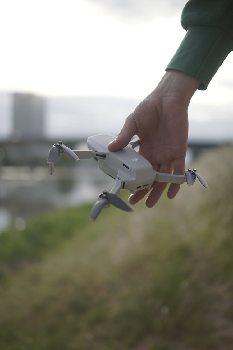 Close-up Of A Man Holding A DJI Mavic Drone 