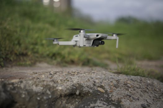 A close drone view of tech set against a rocky surface outdoors.