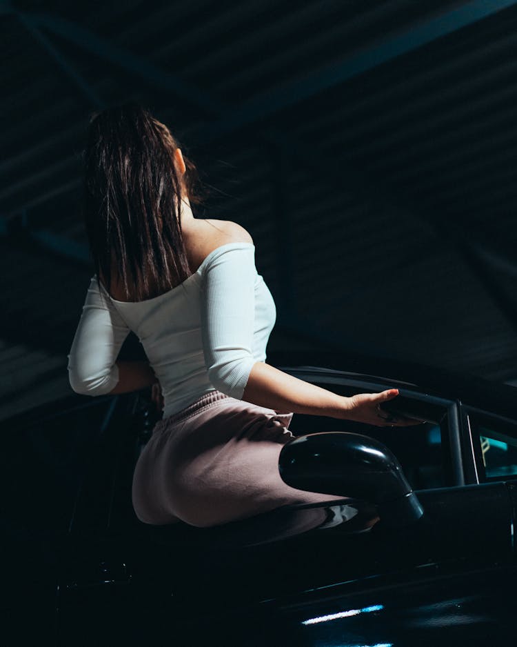 Woman Sitting In Car Window