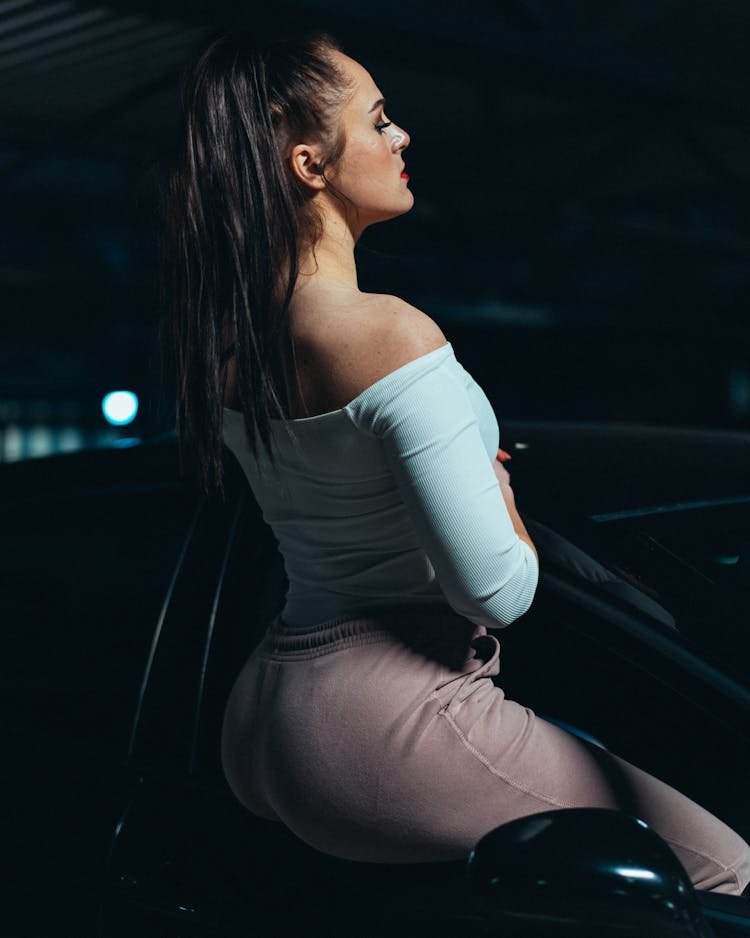 Model Sitting In Car Window