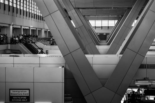 Black and white view of structural beams at an airport terminal in Pasay, Philippines.