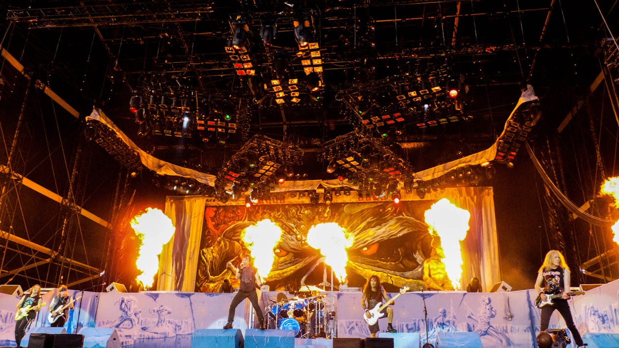 Band Playing on Stage With Fire