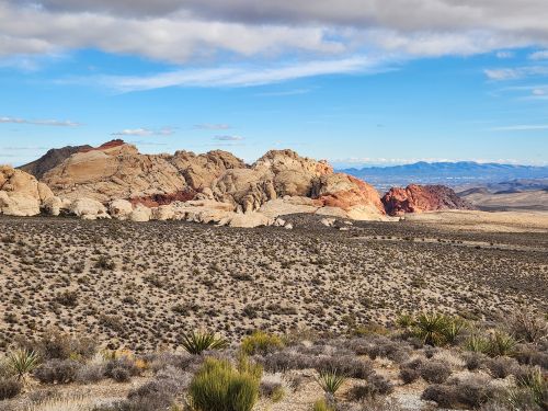 Free Explore the rugged desert terrain with stunning rock formations under a bright blue sky. Stock Photo