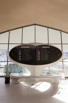 Futuristic departure and arrival board at JFK Terminal in New York City, USA.