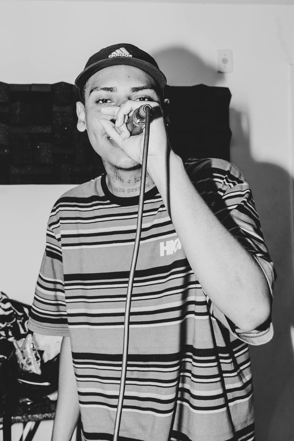 Young Man with a Microphone Rapping · Free Stock Photo