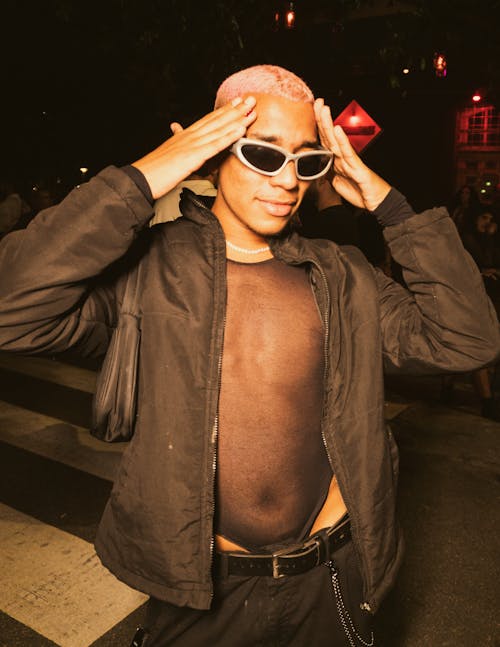 Young Man in a Cool Outfit on the Street at Night 