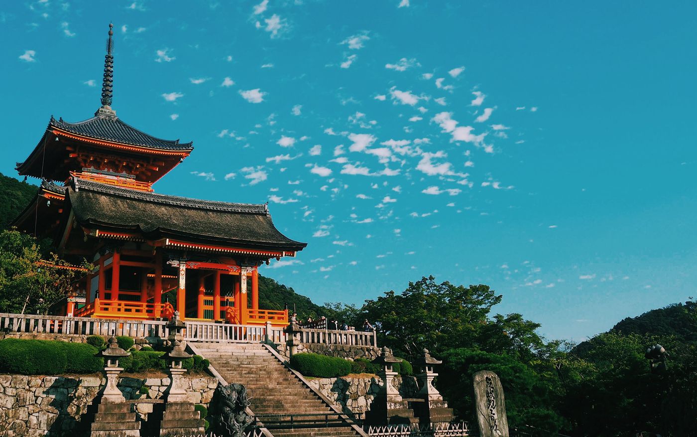 Kiyomizu-dera temple in Kyoto, Japan, under a blue sky