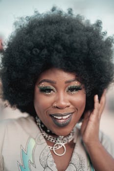 Colorful portrait of a joyful woman with an afro hairstyle, showcasing modern fashion.