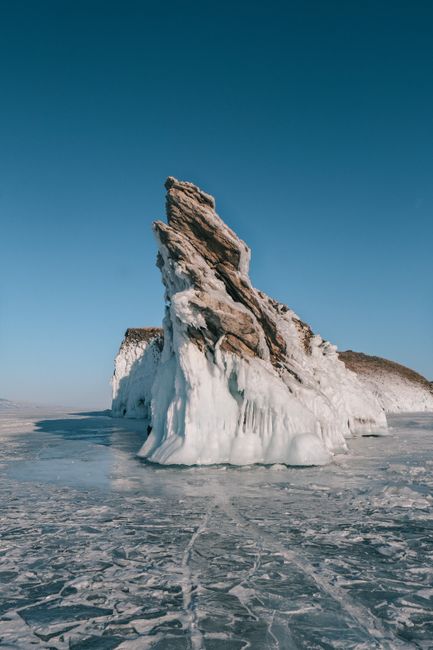 Stunning frozen rock formations rising from the icy surface of Lake Baikal during winter.