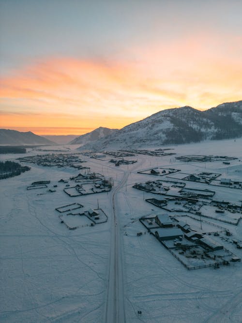 Village in Winter at Sunset