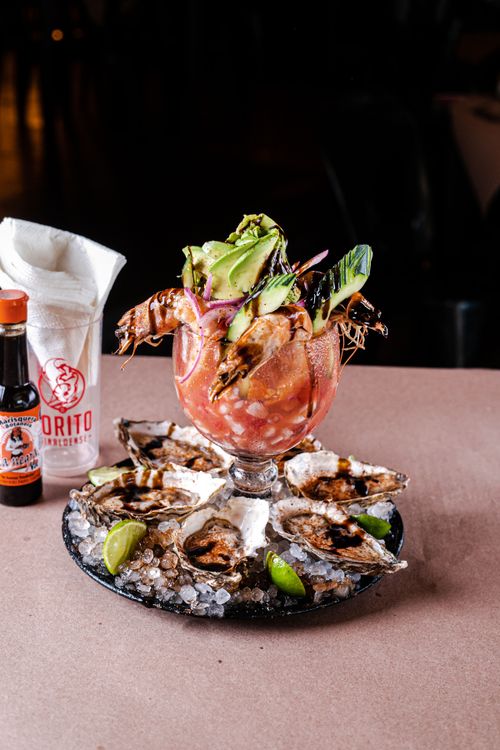 Free Delicious seafood platter with shrimps, oysters, and salsa garnished on ice. Stock Photo